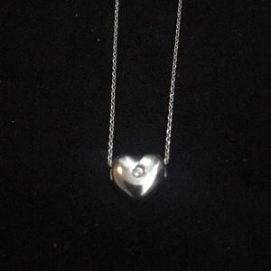 White gold heart pendant with small diamond